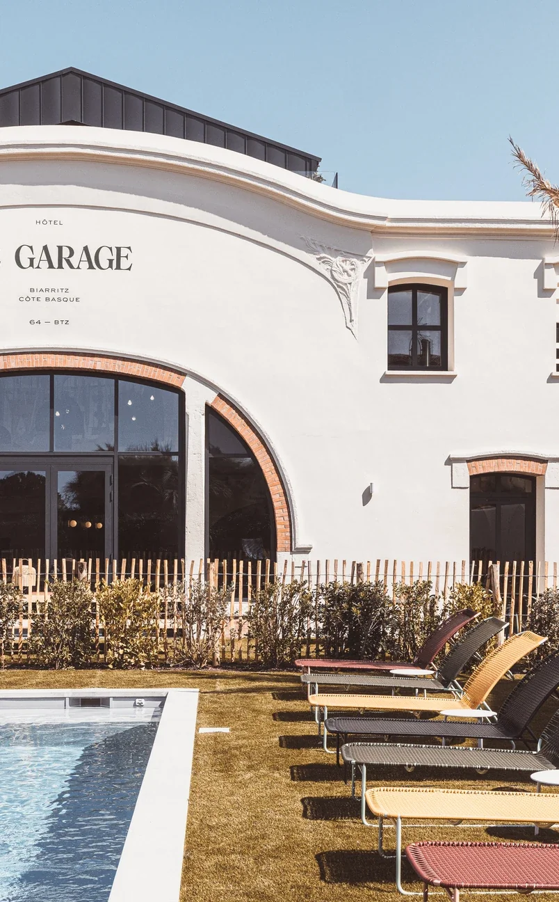Detail of colorful sun loungers by the swimming pool at Hotel Le Garage, Biarritz.
