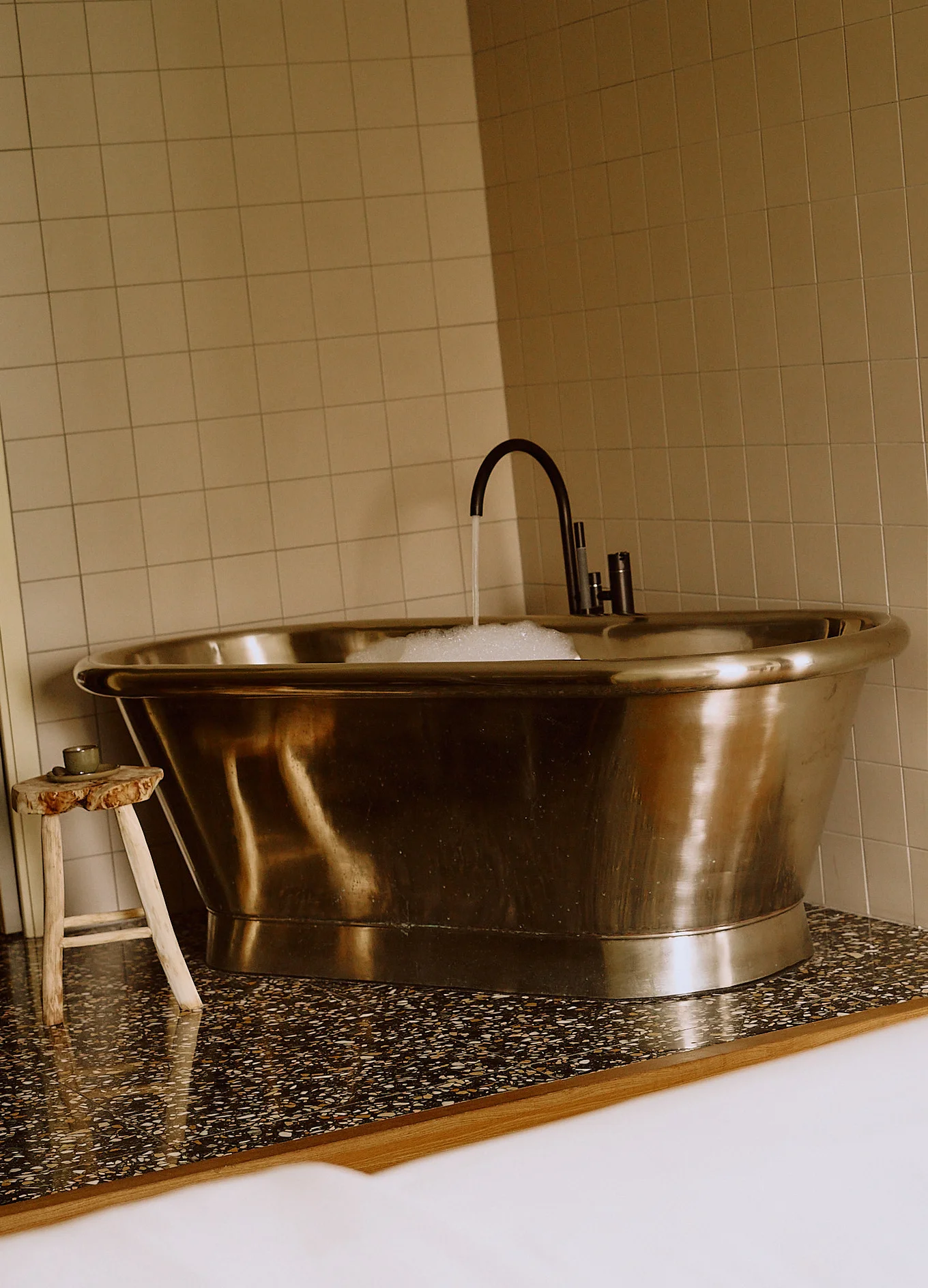 Elegant vintage bathtub in a luxury suite at the Le Garage hotel in Biarritz.