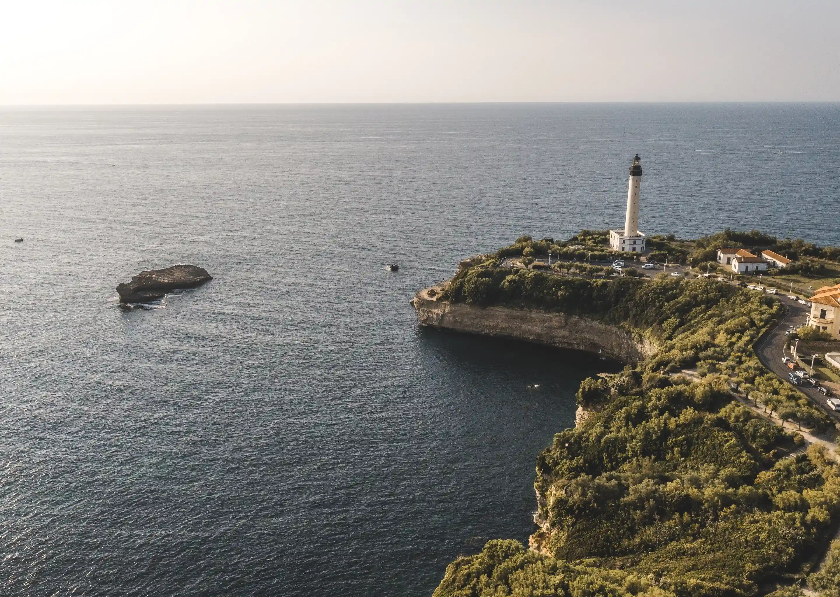 Sunset over the Basque coast with the Biarritz Lighthouse near the Le Garage hotel.