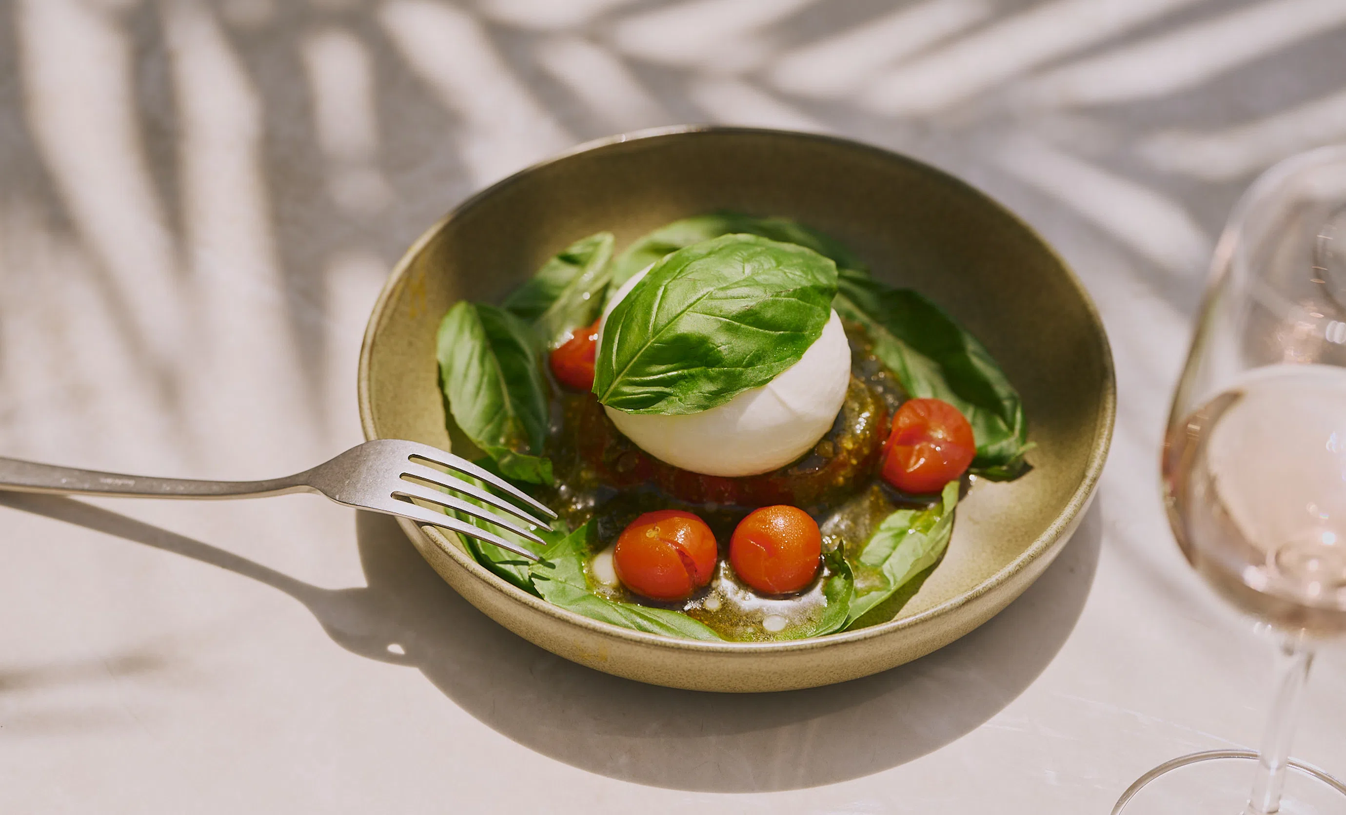 Fresh burrata and cherry tomato salad served at the Le Garage hotel restaurant in Biarritz.