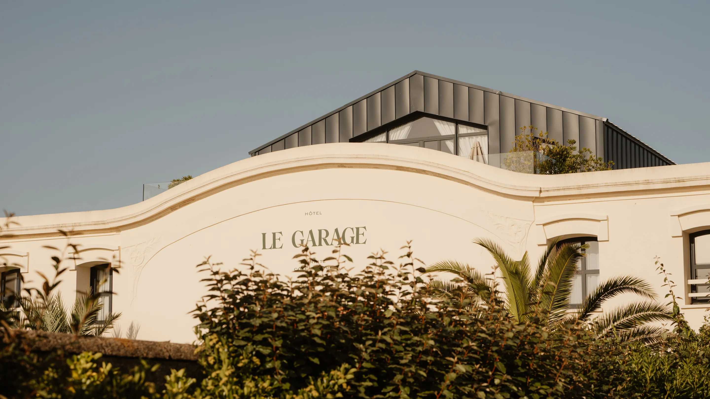 Architectural detail of the rooftop and facade of Hôtel Le Garage in Biarritz, Experimental Group.