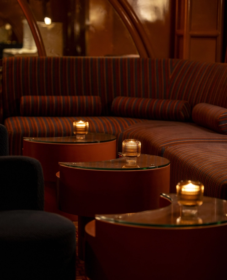 Detailed view of moody, atmospheric lounge seating with soft lighting in an Experimental Group lifestyle hotel destination.