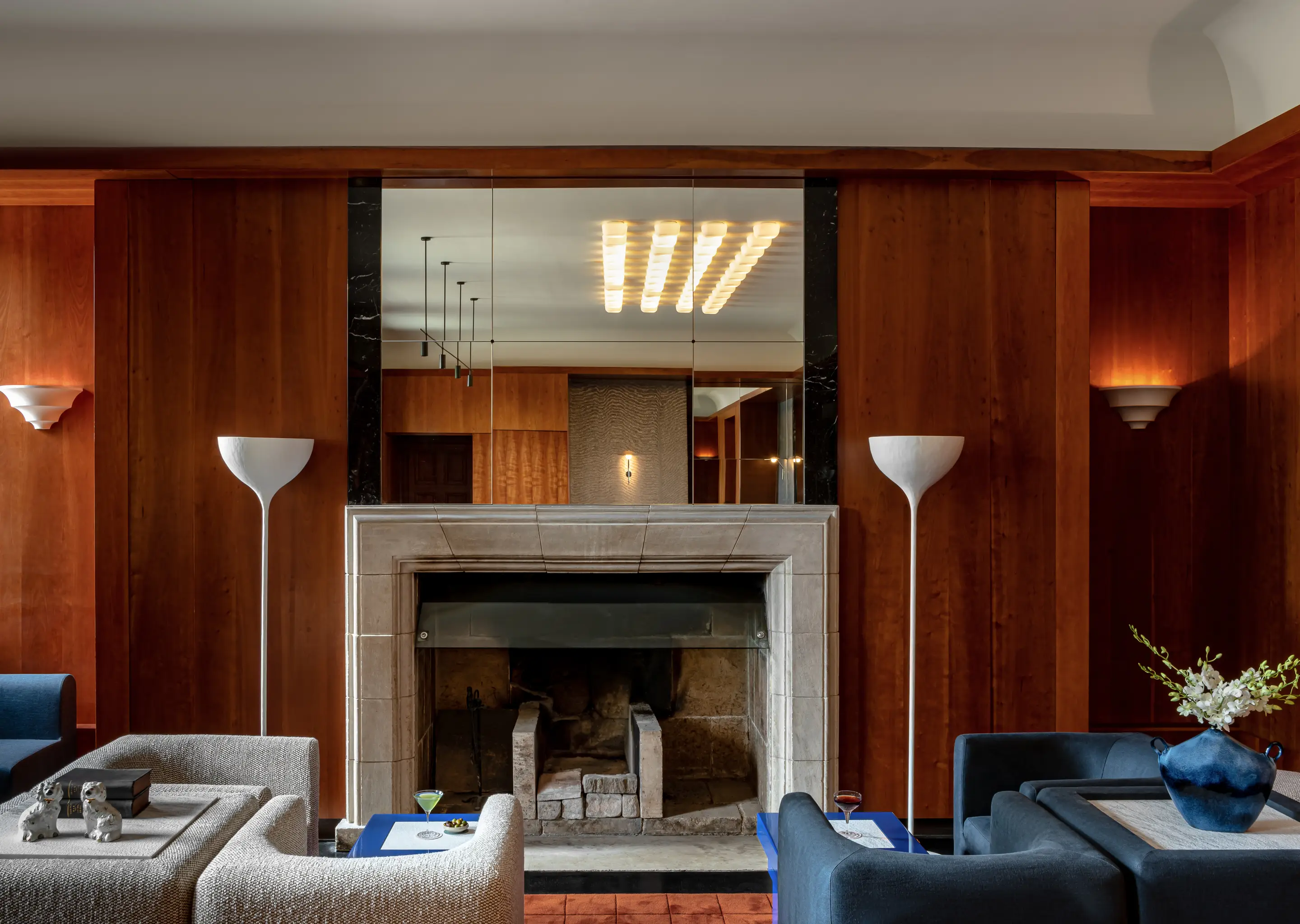 Elegant view of the stone fireplace and cozy lounge area at Cowley Manor Experimental, Cotswolds.
