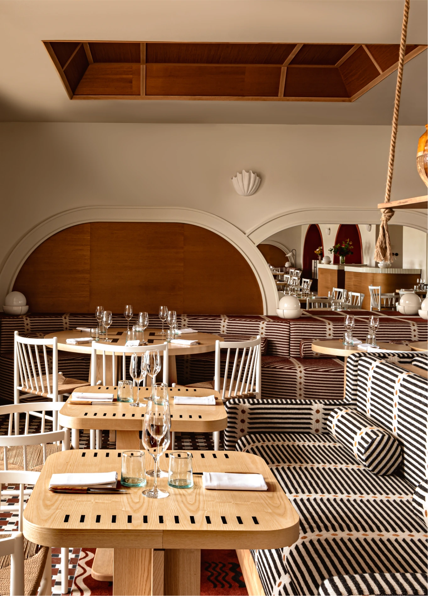 Cozy atmosphere of the Regina Experimental restaurant, emphasizing the architectural details and elegant decor of the dining room.