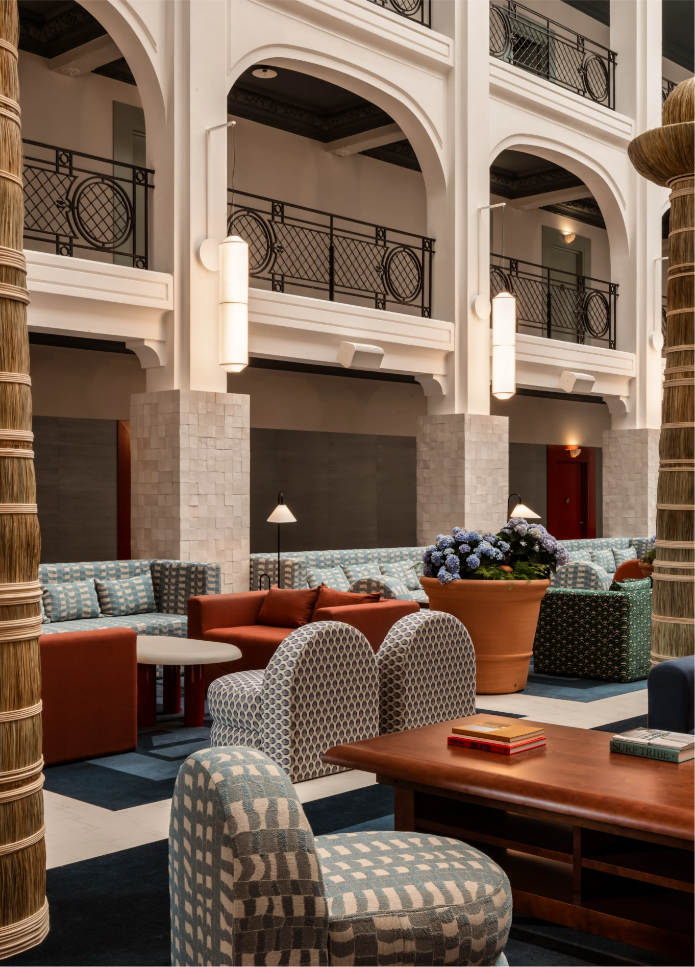 Comfortable and stylish lounge area at the Regina Experimental, blending contemporary furniture with historic architecture.
