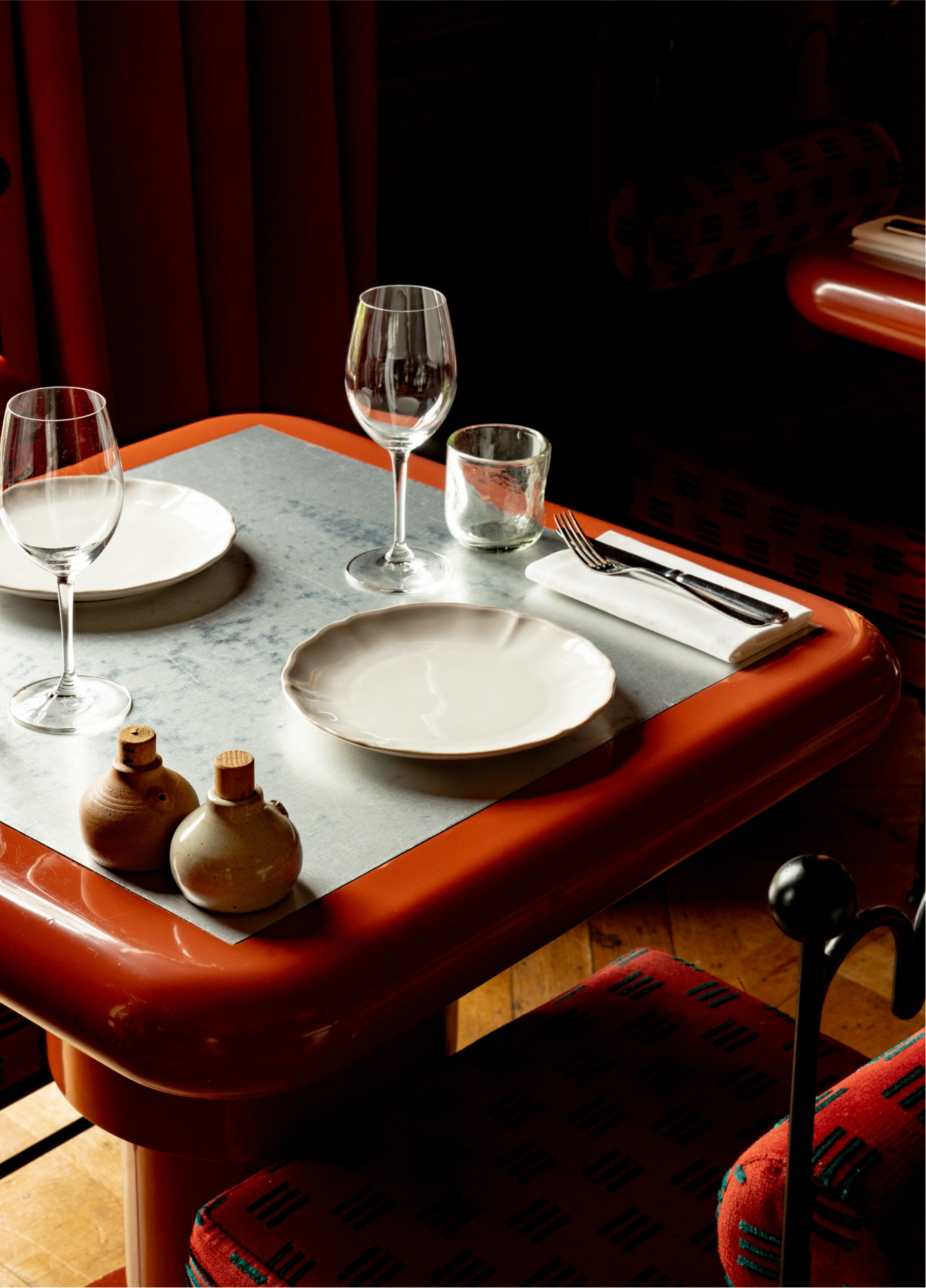 Intimate table setting with glasses at Cowley Manor fine dining restaurant, Cotswolds