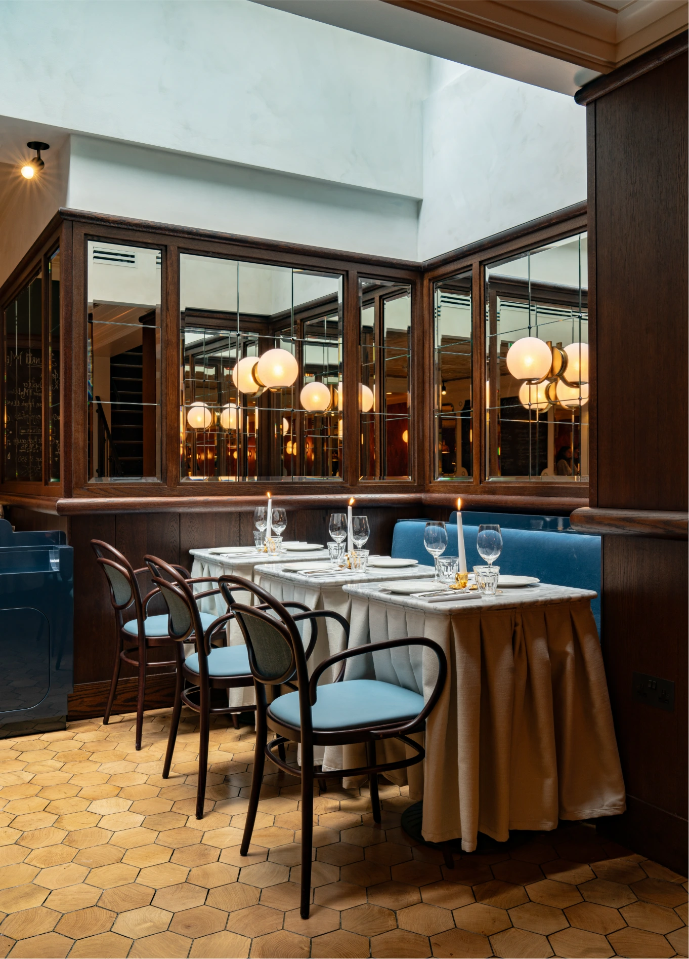 Elegant dining room with dark wood panelling at Henri restaurant, Henrietta Hotel, Covent Garden, London