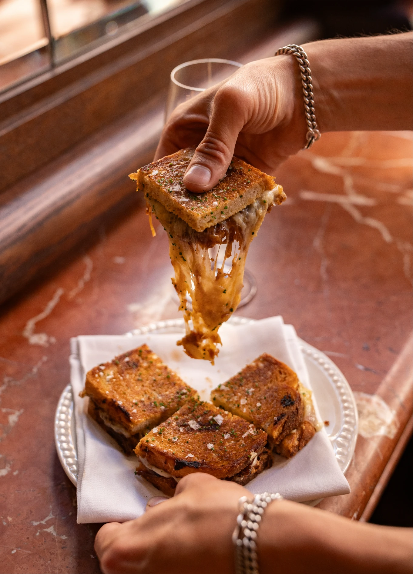 Chef pouring caramel sauce on brioche at Henri French restaurant, Covent Garden, London