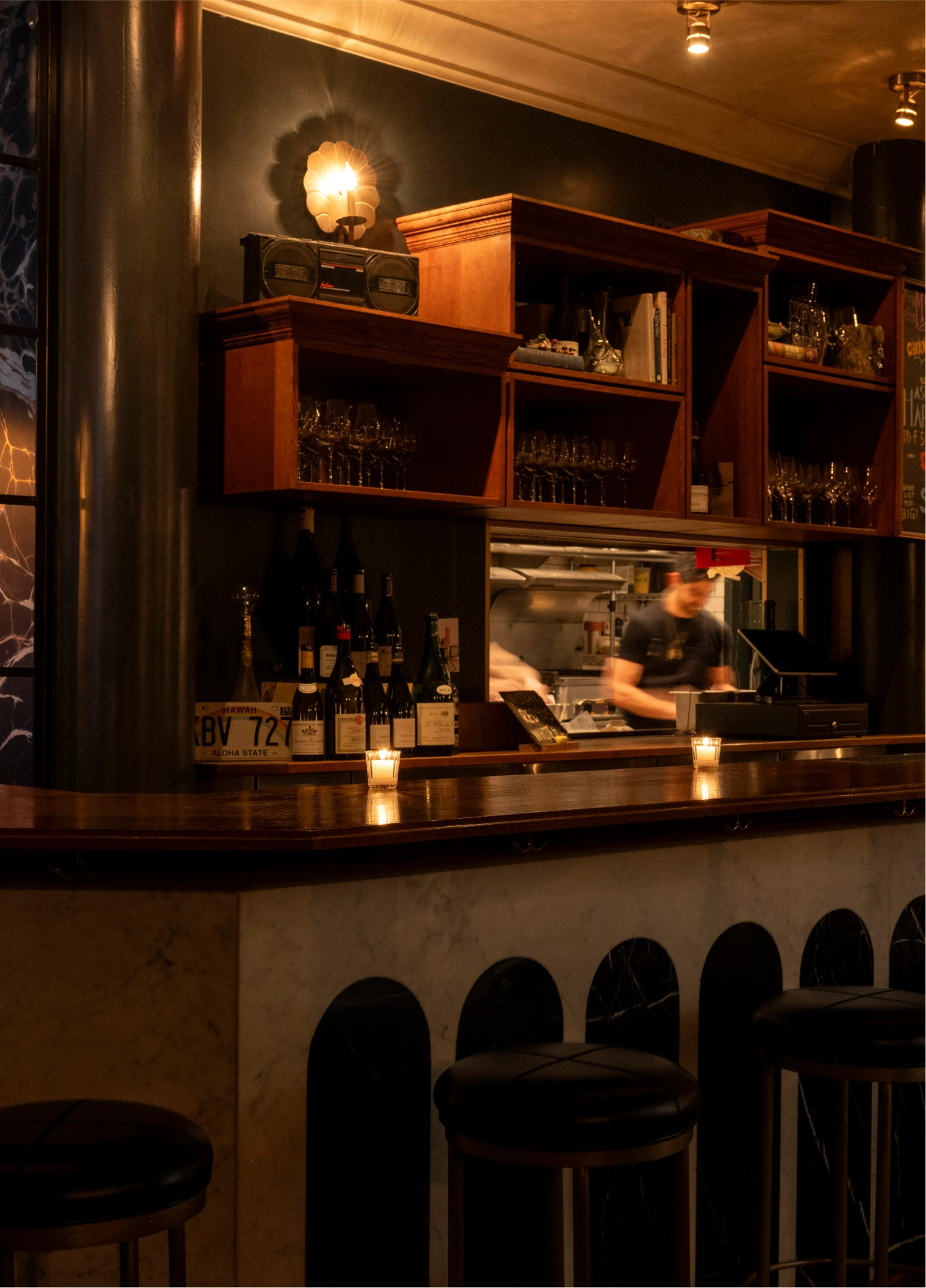 Detailed view of the bar counter highlighting the interior layout and atmosphere of La Compagnie Wine Bar.