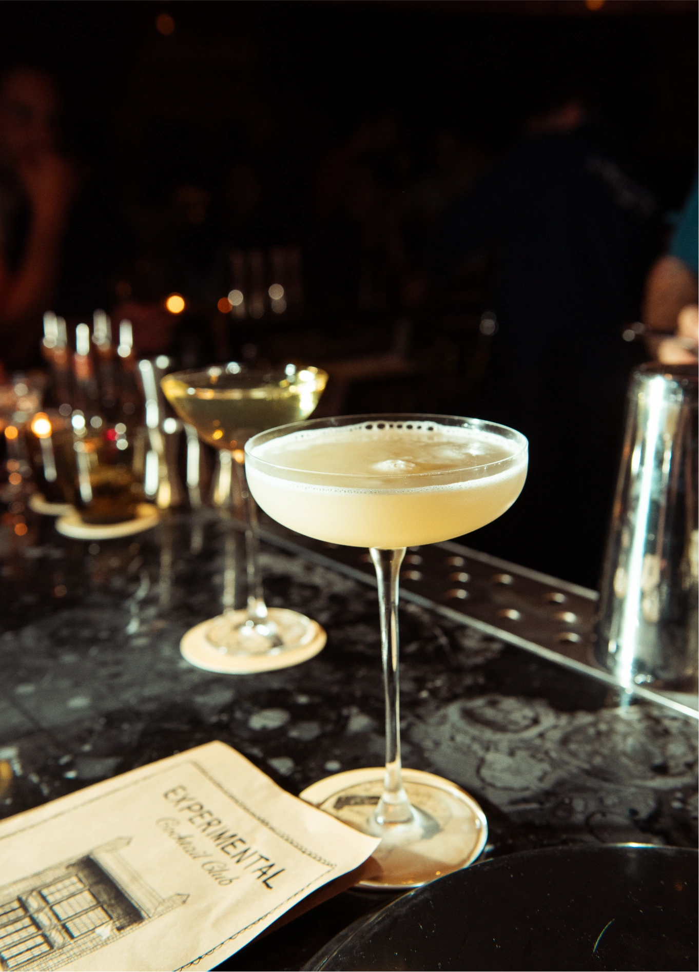 Signature cocktails served at the bar counter of the Experimental Cocktail Club.