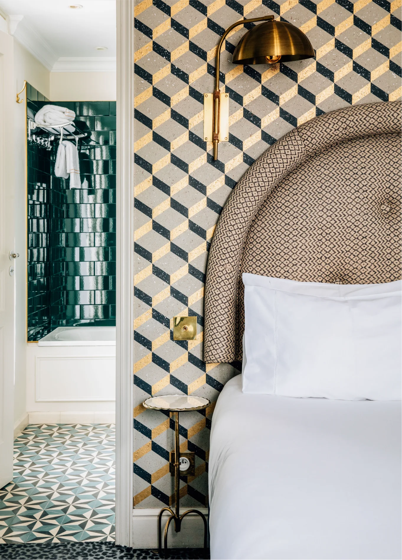 Bedroom with tufted headboard and mosaic tiles at Grand Pigalle Experimental, Paris 9
