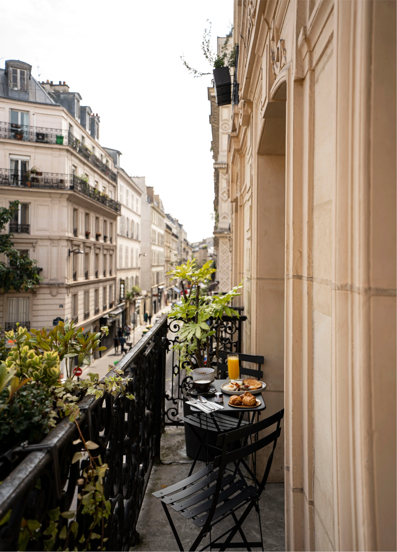View of Parisian rooftops from a green balcony at Grand Pigalle Experimental, Paris 9