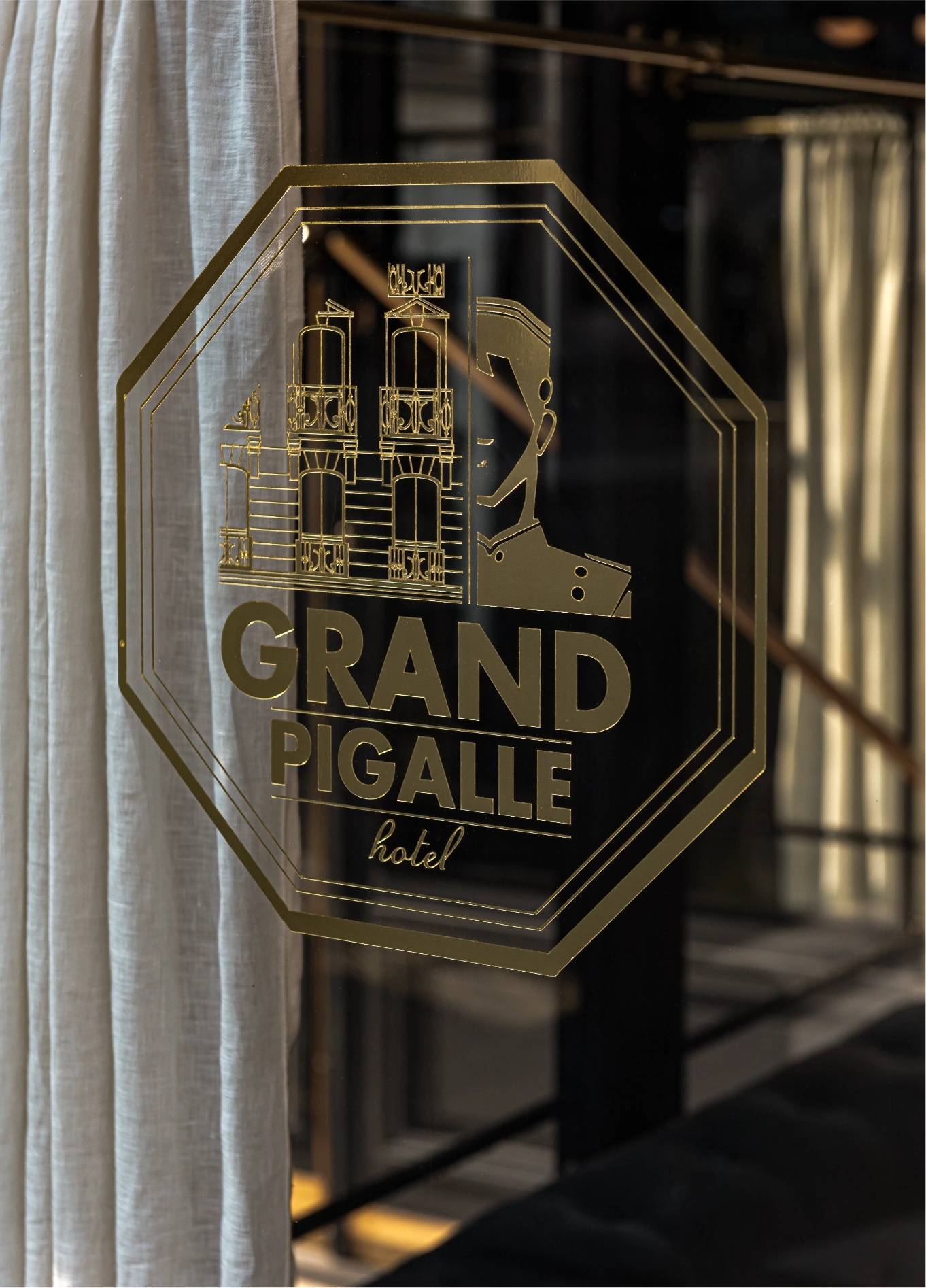 Engraved glass sign of Grand Pigalle Experimental boutique hotel, Paris 9