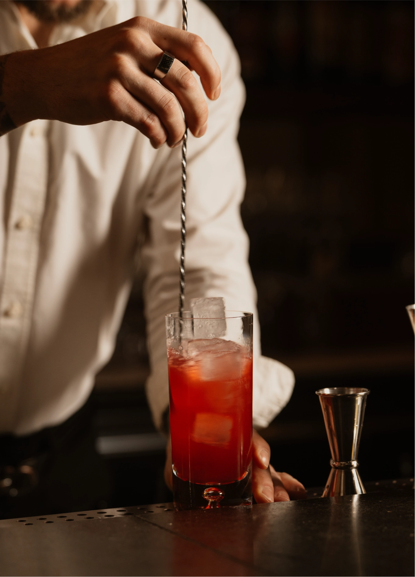 Bartender preparing a red cocktail at American Bar, Experimental Marais, Paris