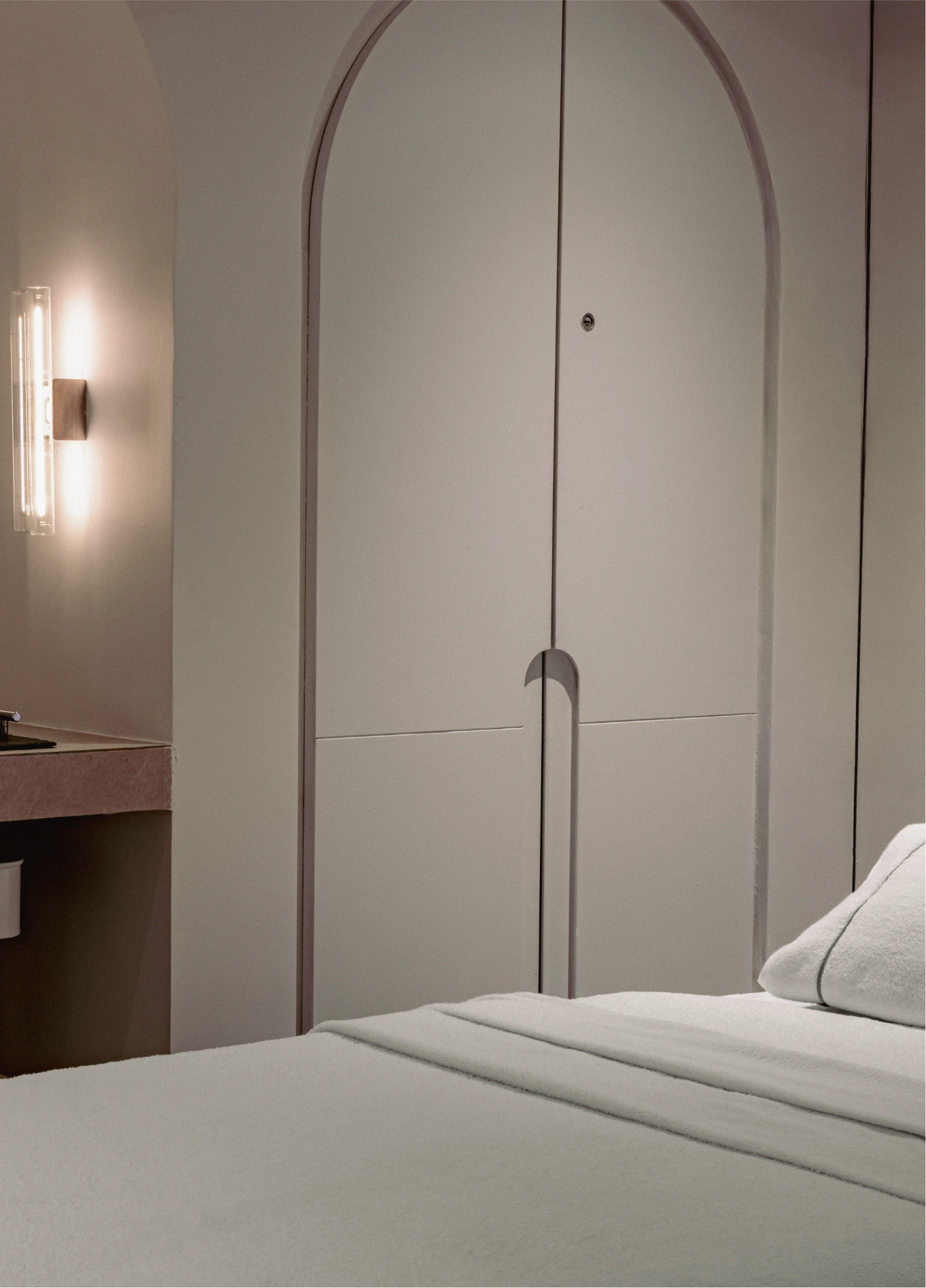 Minimalist bedroom with king size bed and wall light at Spa by Experimental, Marais, Paris