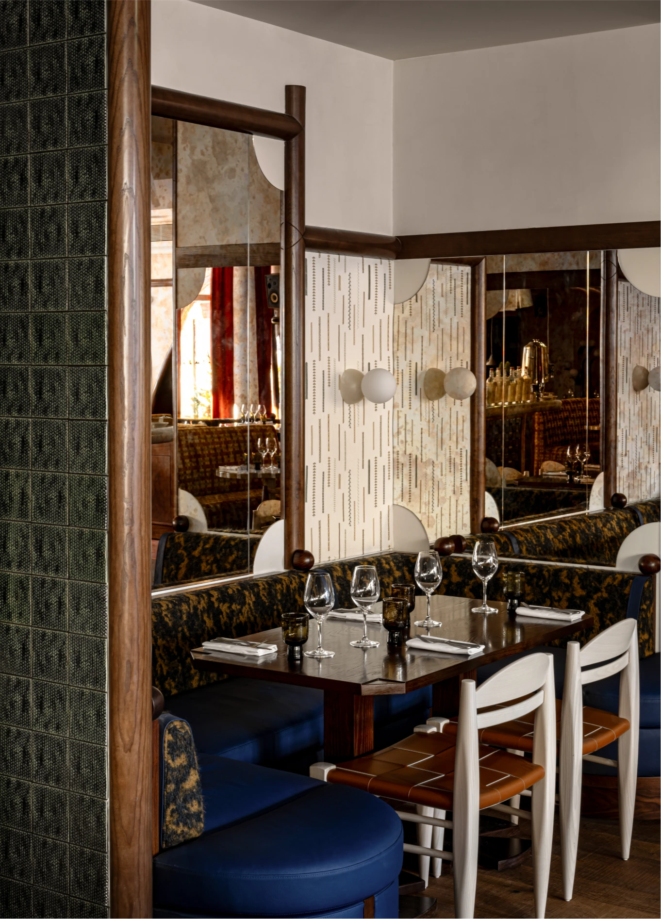 Elegant dining room with green tiles at L'Aigle d'Or fine dining restaurant, Val d'Isère, French Alps