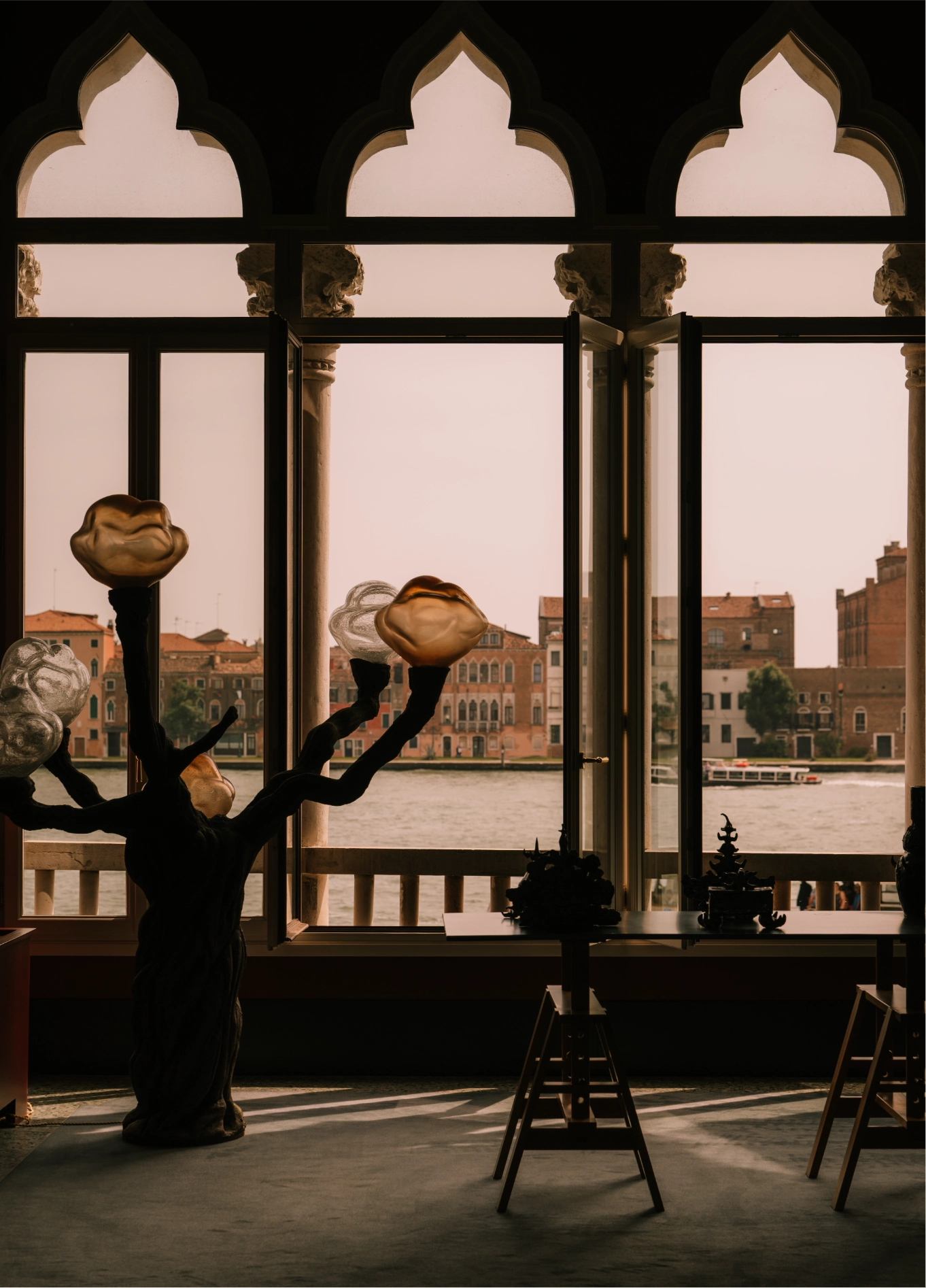 View of the Grand Canal through arched windows at Il Palazzo Experimental, Venice