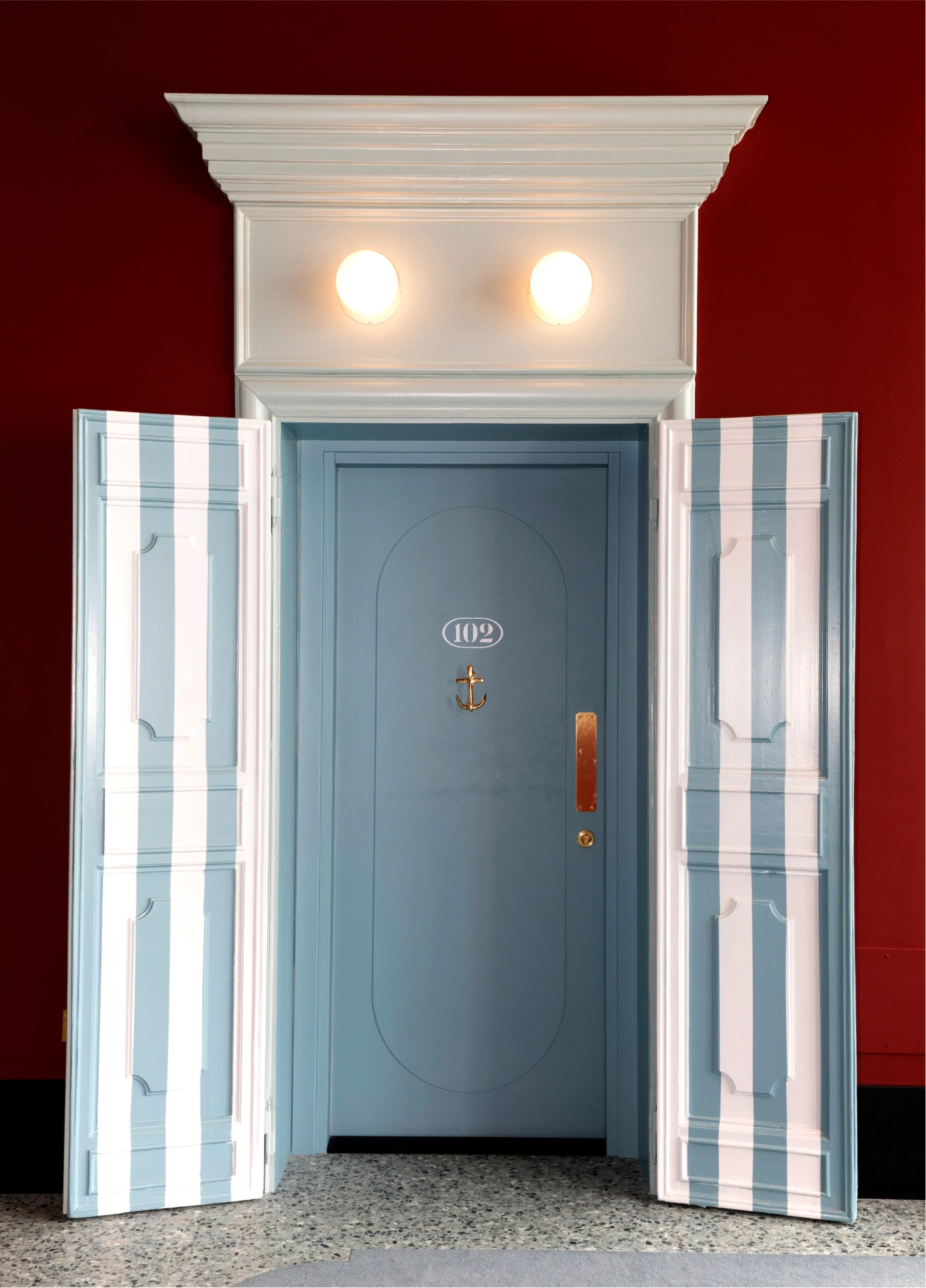 Blue elevator doors with red walls at Il Palazzo Experimental boutique hotel, Venice
