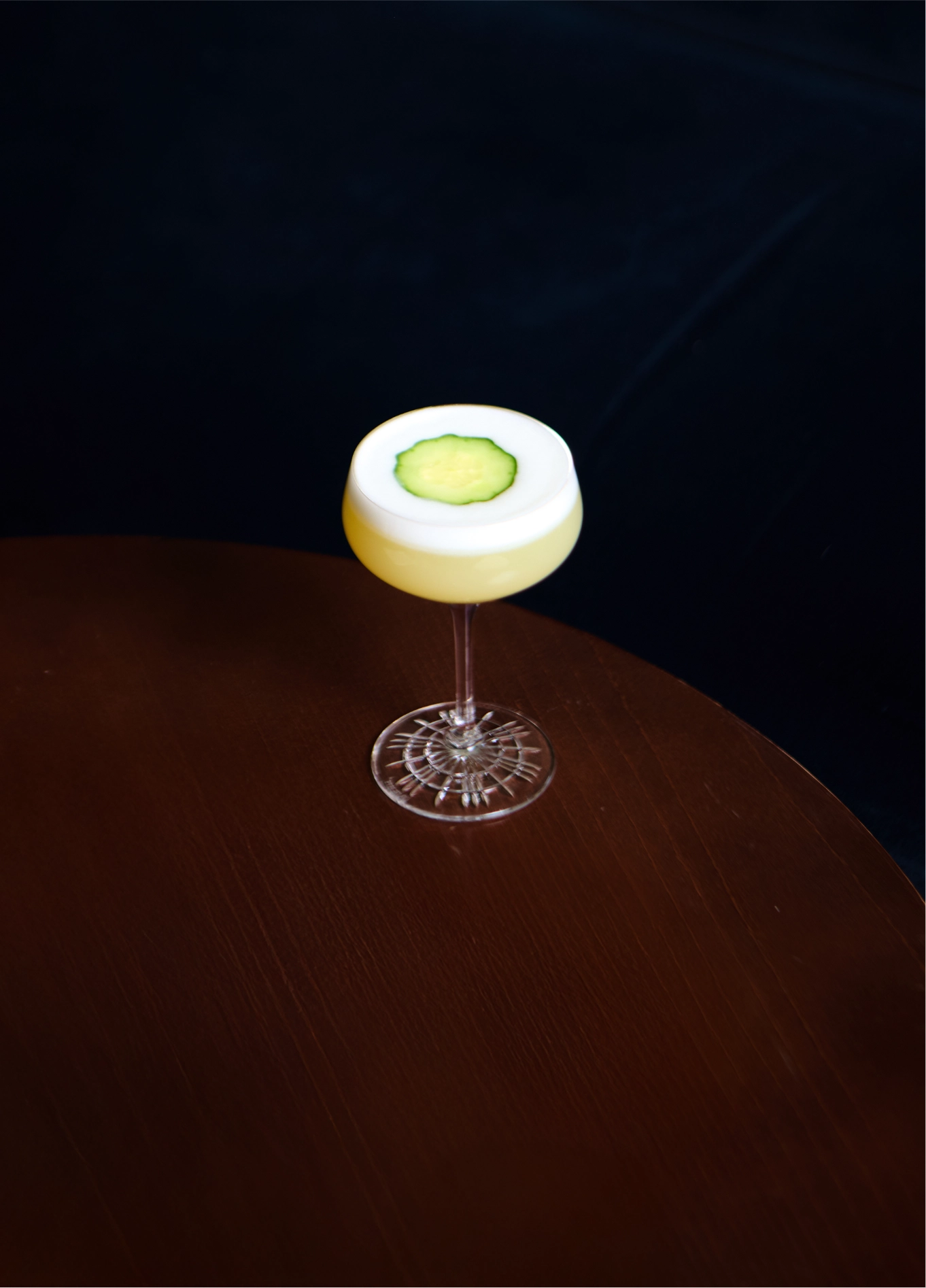 Glowing green cocktail on dark background at Experimental Cocktail Club, Verbier, Swiss Alps