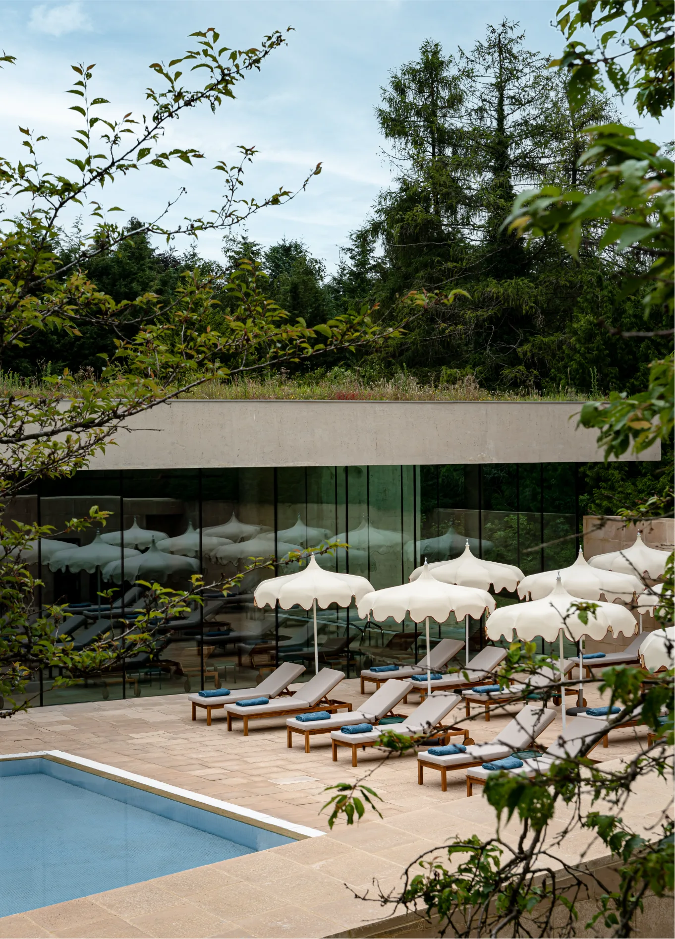 Outdoor pool at Cowley Manor luxury spa hotel in the Cotswolds