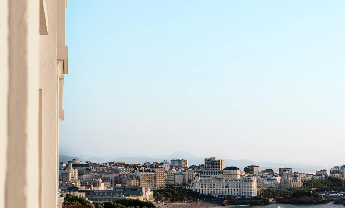 Experimental Group hotel terrace or balcony with aerial view over Rome urban skyline and residential rooftops