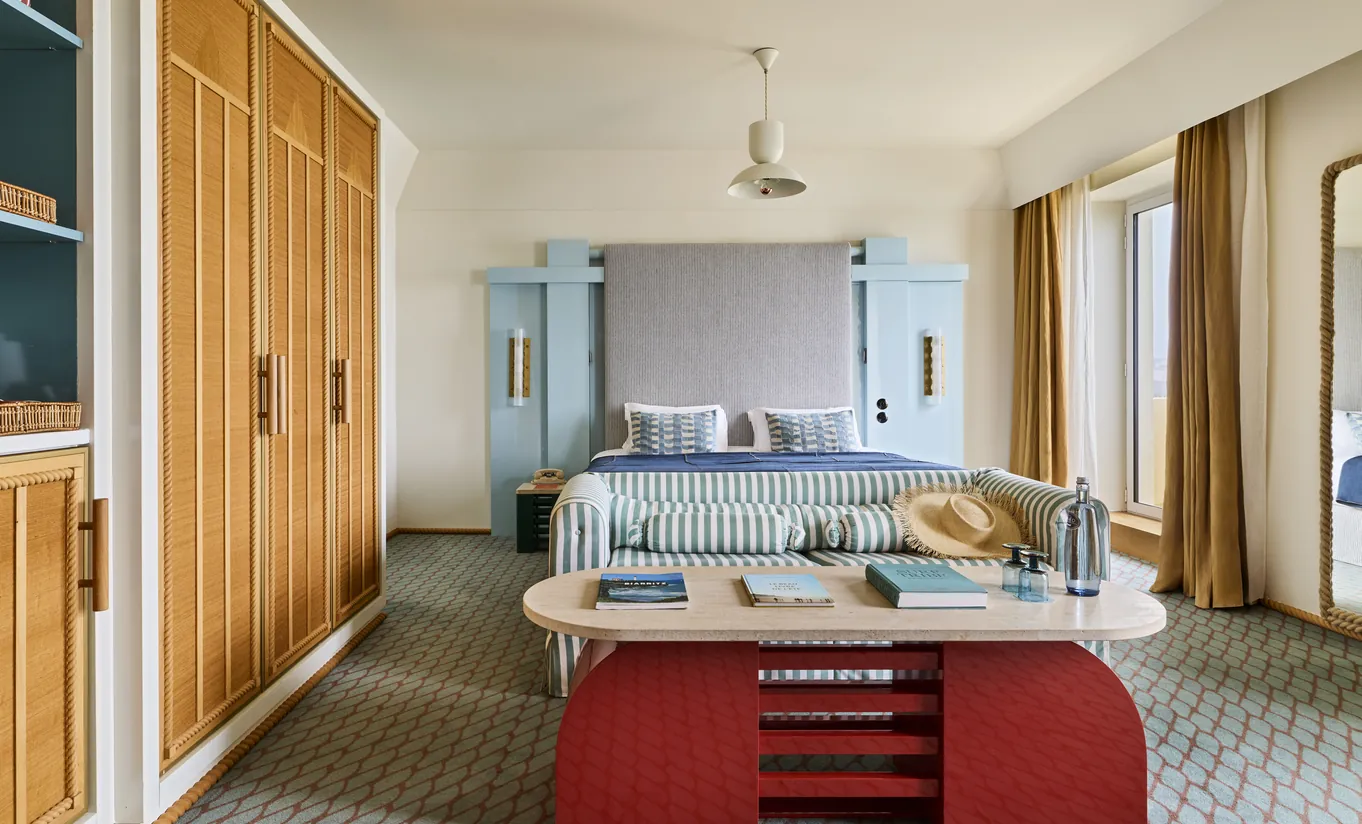 Contemporary and elegant hotel room with red desk, Experimental Group.
