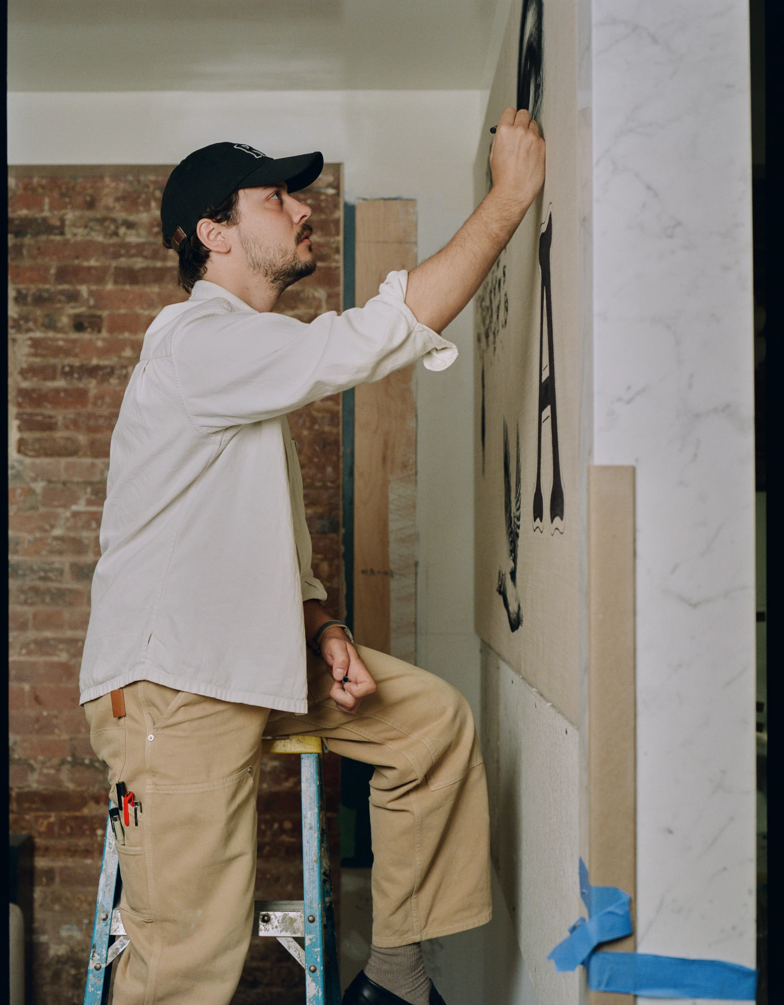 Team member working on interior design, illustrating the expertise and commitment of the Experimental Group to creating unique spaces.