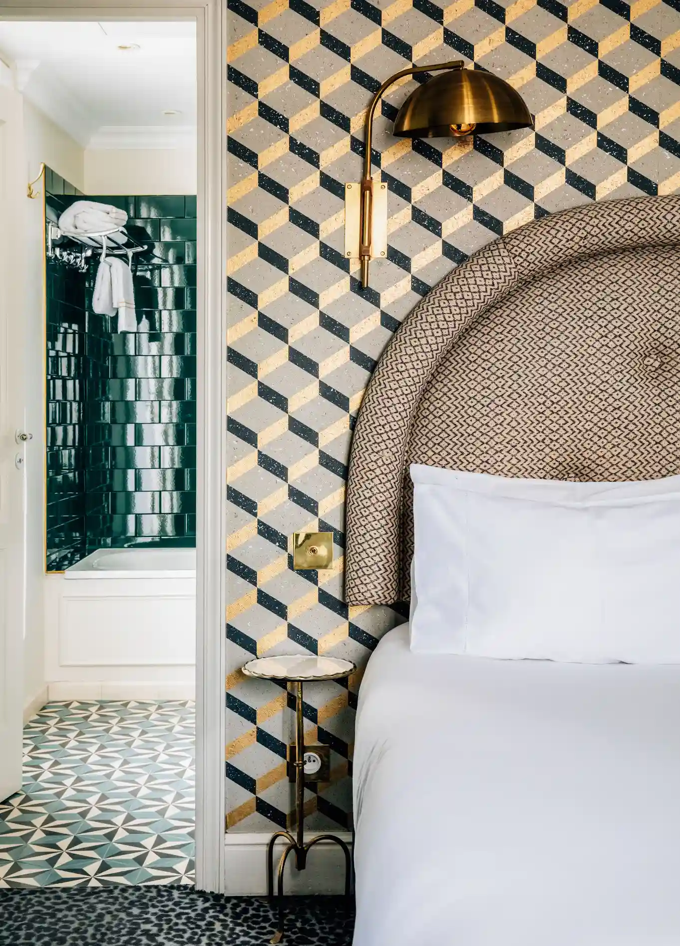 Bedroom with tufted headboard and mosaic tiles at Grand Pigalle Experimental, Paris 9