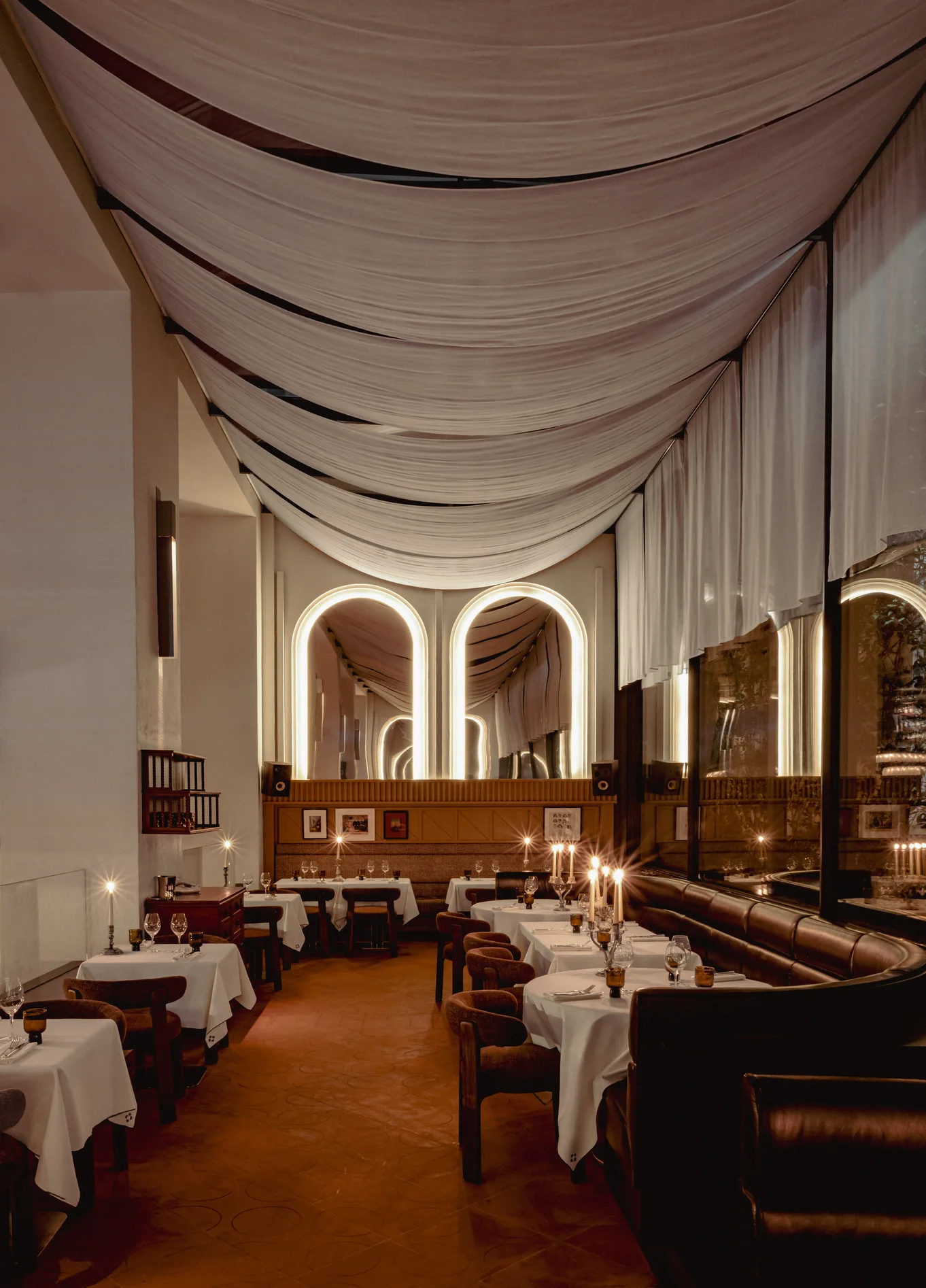 Long dining room with arches and white tablecloths at Temple & Chapon, Experimental Marais, Paris