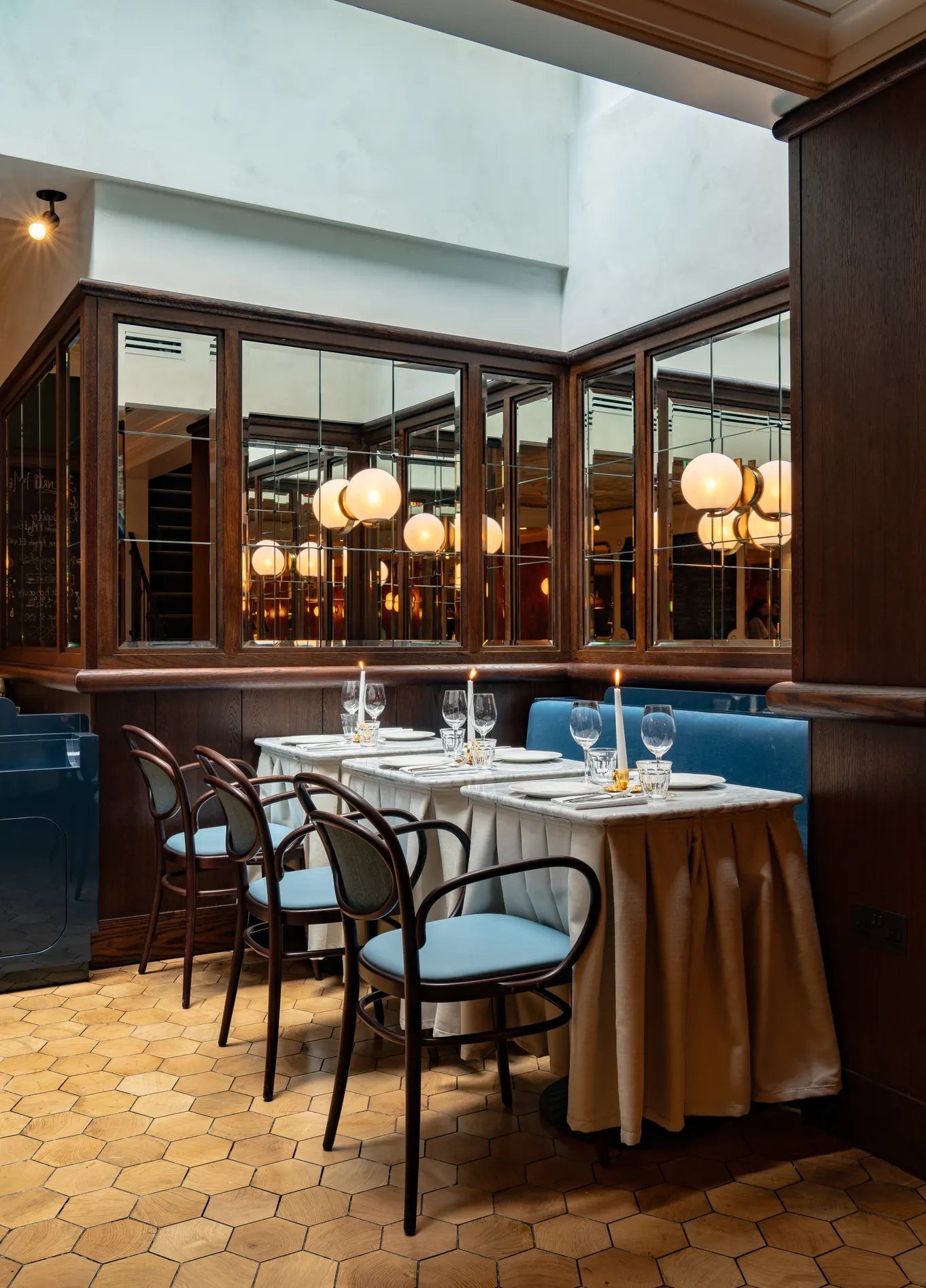 Elegant dining room with dark wood panelling at Henri restaurant, Henrietta Hotel, Covent Garden, London